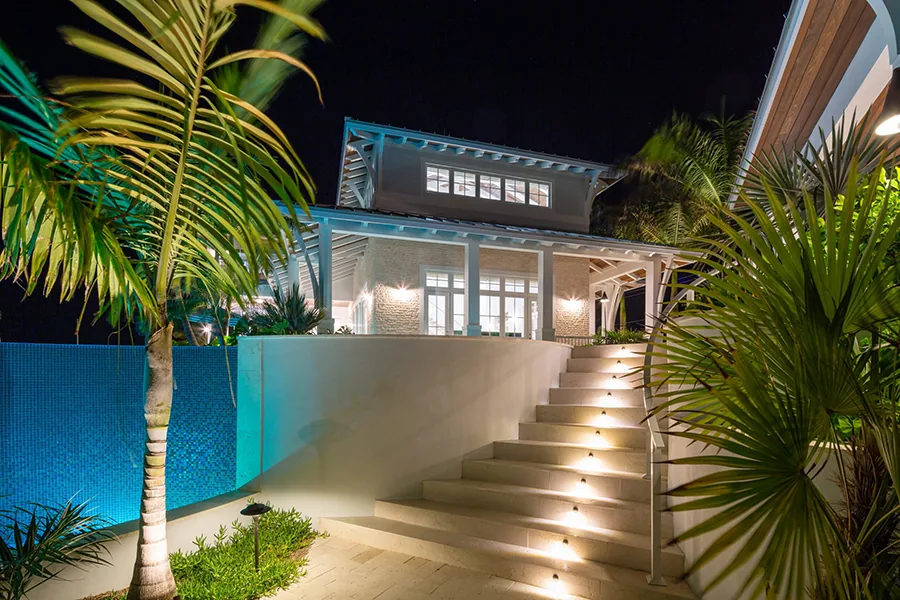 Professional landscape lighting installation illuminating a luxury home in Dallas